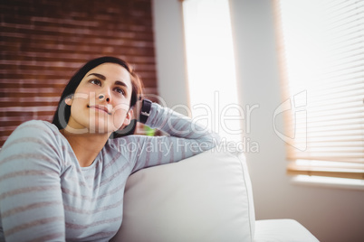 Thoughtful woman at home