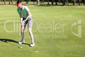 Full length of woman playing golf