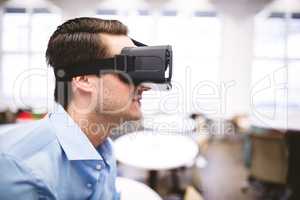 Side view of executive enjoying virtual reality headset at offic