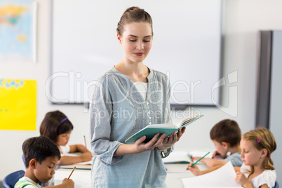 Teacher teaching students in classroom