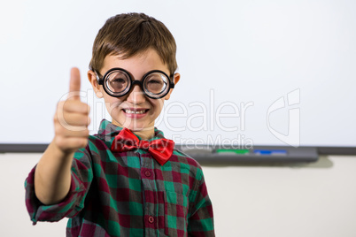 Smiling boy gesturing thumbs up sign