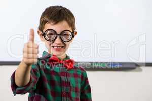 Smiling boy gesturing thumbs up sign