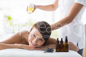 Portrait of woman receiving massage treatment