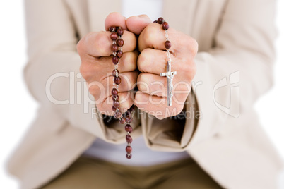 Woman holding rosary beads