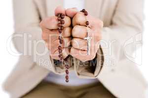 Woman holding rosary beads