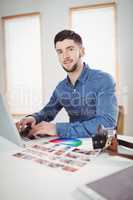 Portrait of confident man working at office