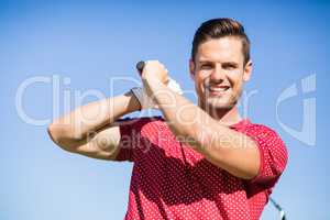 Portrait of golfer man taking shot
