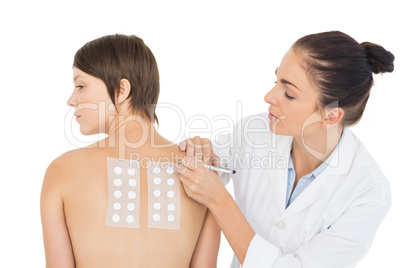 Doctor examining patient back