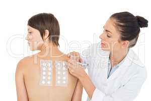 Doctor examining patient back