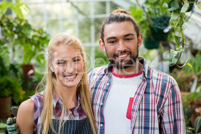 Portrait of colleagues at standing at greenhouse