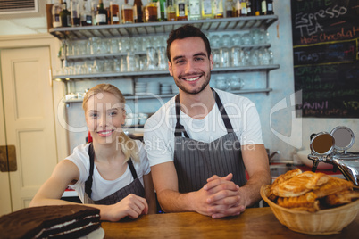 Portrait of happy employees at cafe