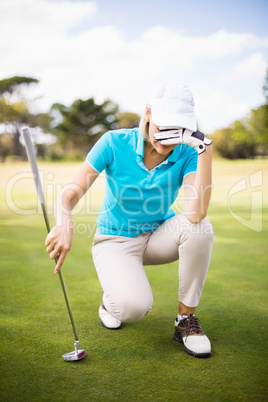 Woman hiding face at golf course