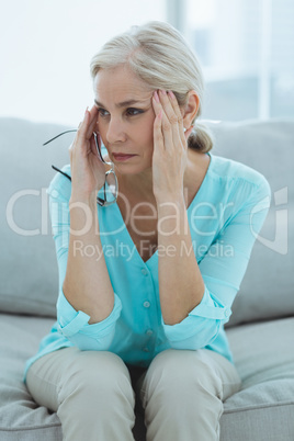 Senior woman suffering headache