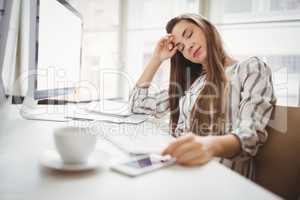 Businesswoman relaxing in creative office