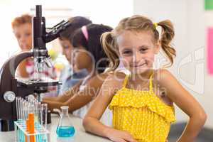 Girl with classmates in laboratory