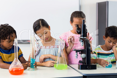 Children with scientific equipment