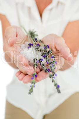Midsection of woman holding flowers