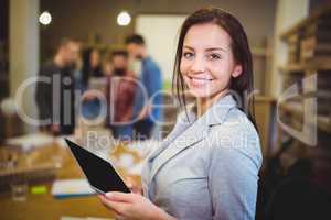 Young businesswoman holding digital tablet