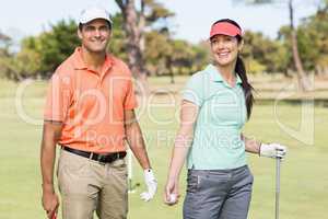 Portrait of smart golfer couple