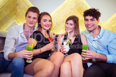 Portrait of happy couple in nightclub