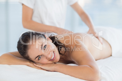 Portrait of smiling woman enjoying massage