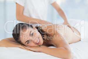 Portrait of smiling woman enjoying massage