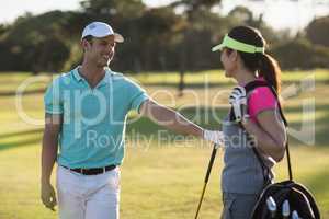 Happy golf player couple