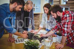 Business people drawing on blackboard during meeting