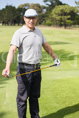 Portrait of golfer holding his golf club Portrait of golfer holding his golf club