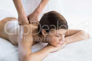 Relaxed woman enjoying back massage