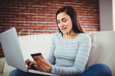 Young woman doing online shopping