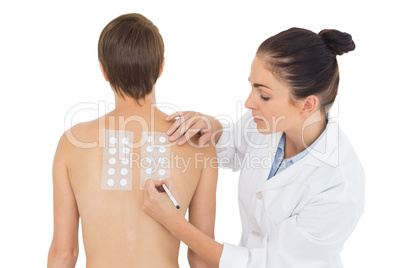 Doctor examining woman back
