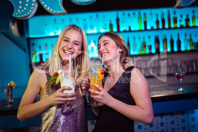 Young female friends enjoying at nightclub