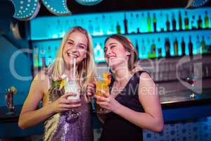Young female friends enjoying at nightclub