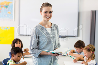 Confident female teacher with students