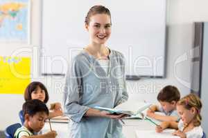 Confident female teacher with students