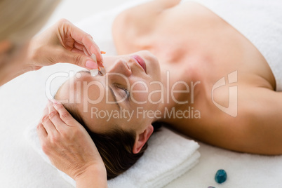 Woman receiving massage treatment