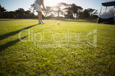 Low section of male golfer