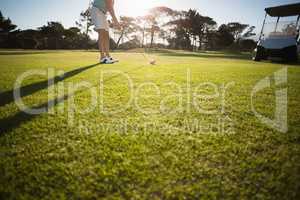 Low section of male golfer