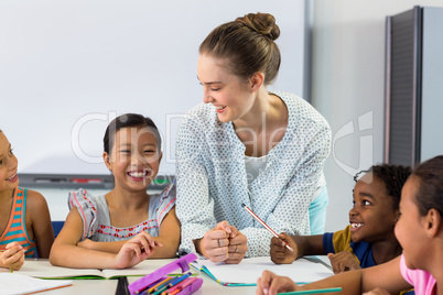 Female teacher with schoolchildren