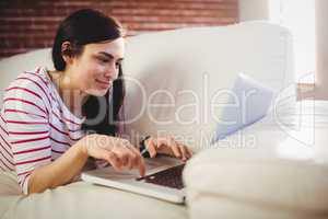 Young woman using laptop