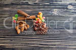 Chips of chocolate and nuts on textured board