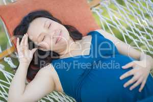 Young Pregnant Chinese Woman Resting in Hammock