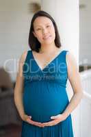 Portrait of Young Pregnant Chinese Woman on the Front Porch