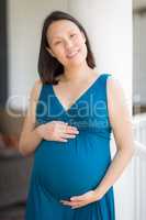 Portrait of Young Pregnant Chinese Woman on the Front Porch