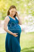 Young Pregnant Chinese Woman Portrait Outdoors