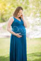 Young Pregnant Chinese Woman Portrait in a Garden