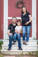 Portrait of Happy Mixed Race Pregnant Couple with Young Son