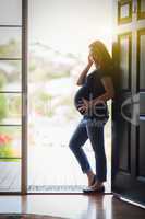 Chinese Pregnant Woman Silhouetted in Doorway