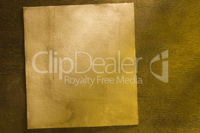 Grunge paper on wooden background